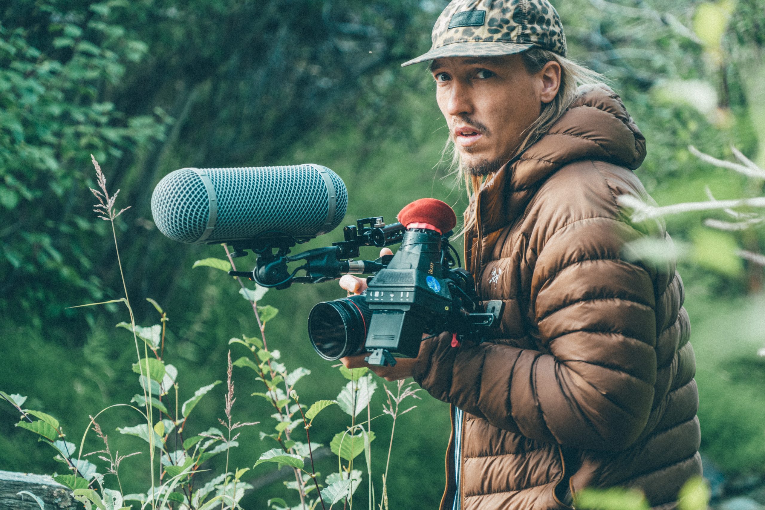 Jonny von Wallström filming with a camera and boom microphone
